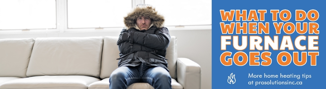 Miserable man sitting on couch with winter jacket on wondering what to do when your furnace goes out.